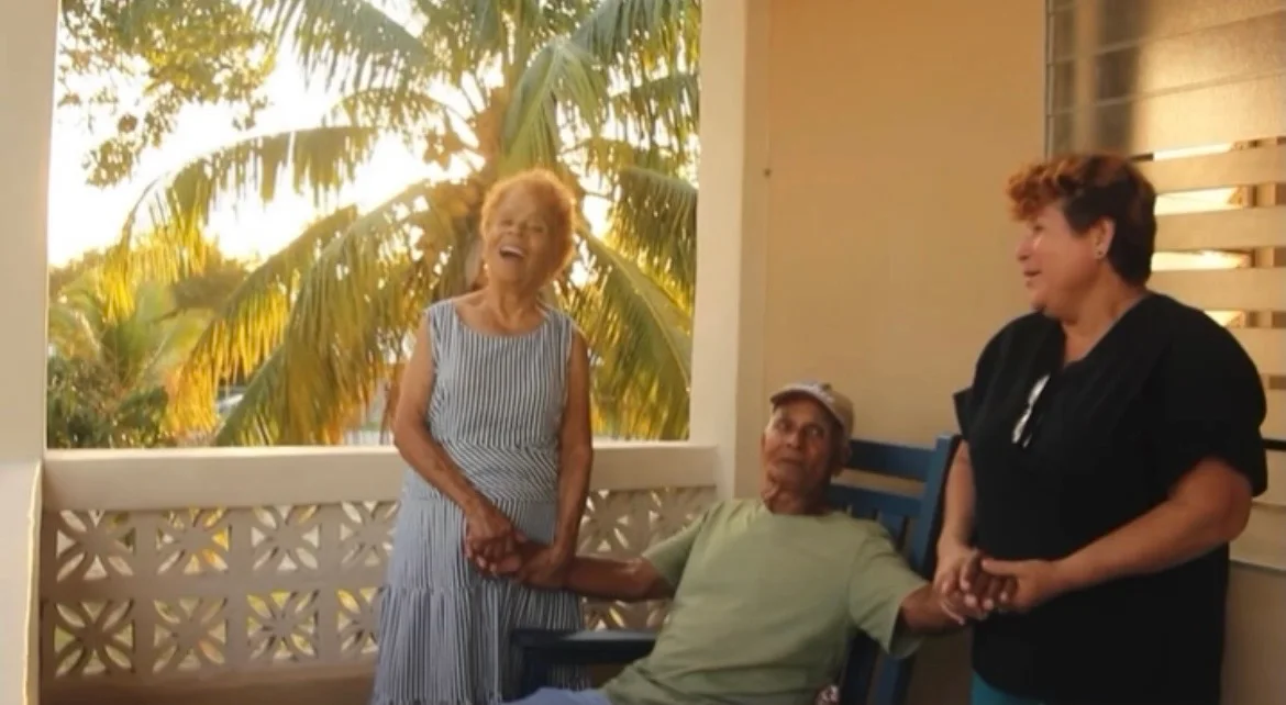 Residents and Care Taker, enjoying a laugh and breeze.